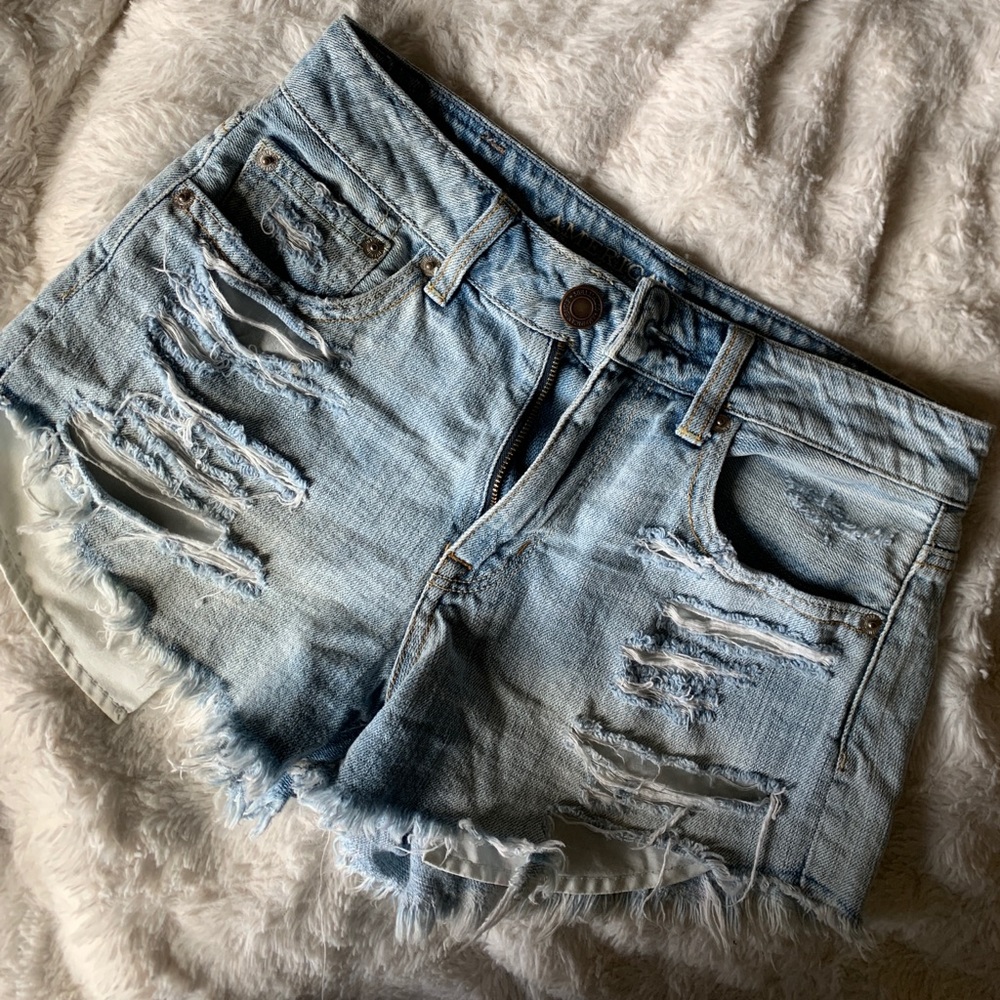 Distressed light denim shorts